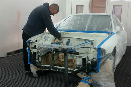 Panel replacement work on damaged vehicle door